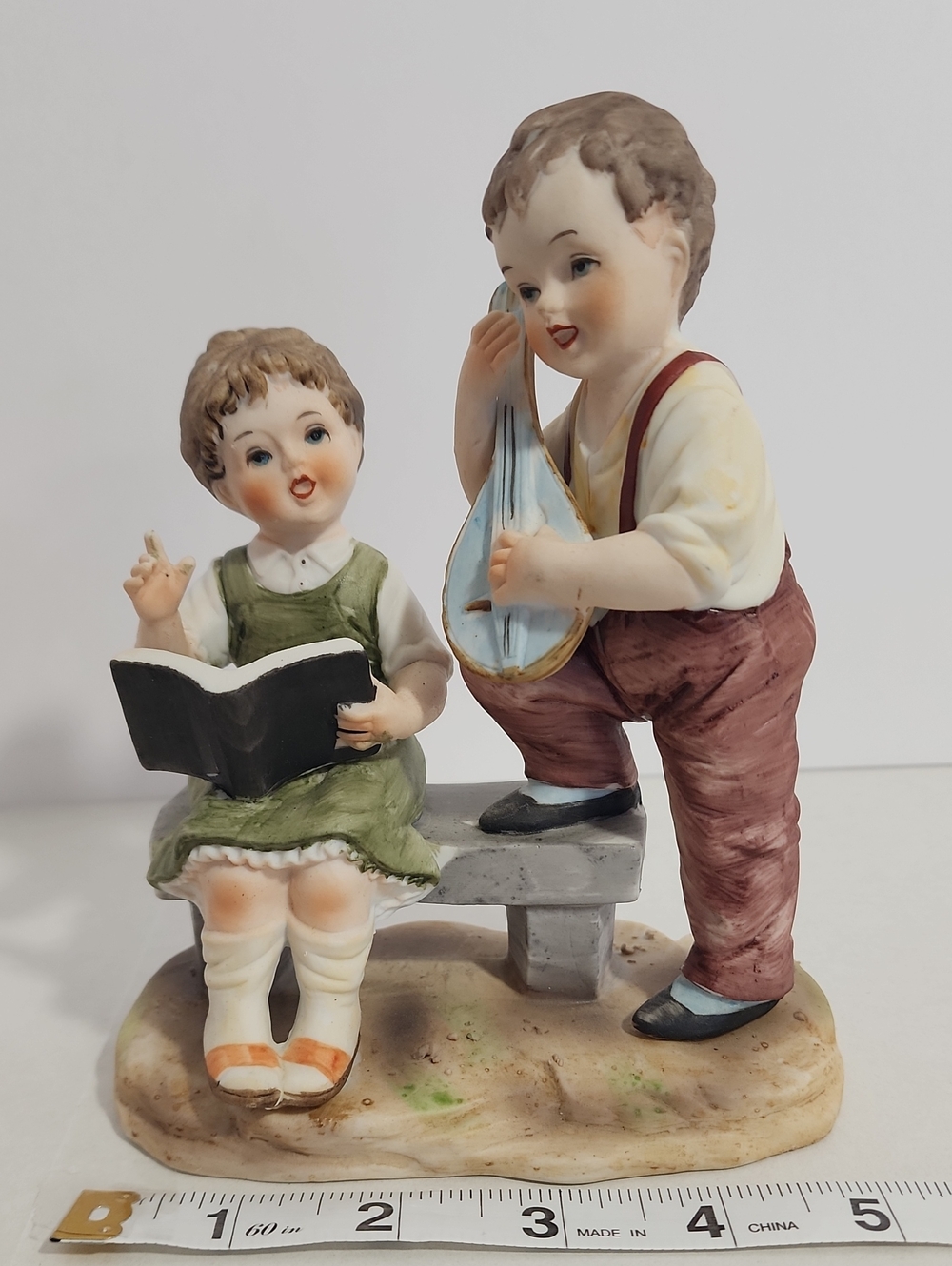 Porcelain Figurine of Singing Children in Green and Brown